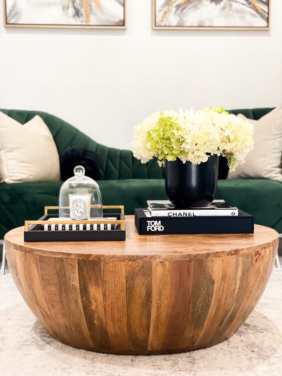 Styled coffee table with art books and candle