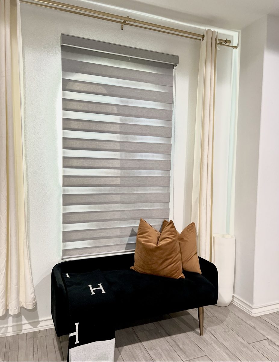 Window nook with bench seating and layered pillows